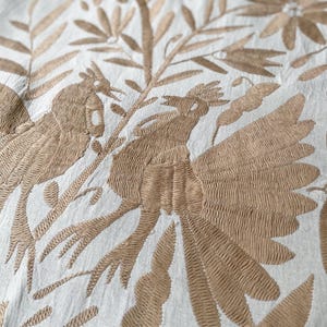 Beige Tenango Otomi hand embroidered vertically oriented table runner