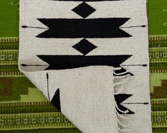Handwoven wool runner rug from Teotitlan del Valle, Oaxaca, Mexico featuring geometric black and white design—unique piece