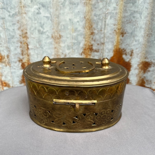 Vintage oval brass box.Pierced metal box with a handle and latches.Trinket box,jewelry keeper,shelf sitter,stand alone decor.