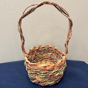Handwoven Decorative Basket with Braided Handle. Easter basket. Pastel colored storage basket. Artisanal vibe. Multi colored basket.