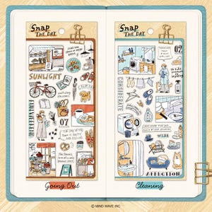 May include: Two sticker sheets with hand-drawn illustrations. One sheet features a bicycle, cafe, and text "Going Out". The other sheet shows a washing machine, laundry, and text "Cleaning". Both sheets have the text "Snap The Day".