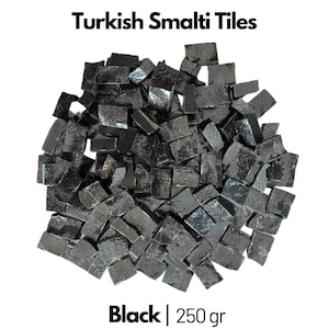 May include: A pile of black Turkish smalti tiles, weighing 250 grams. The tiles are small, irregular squares with a glossy finish.