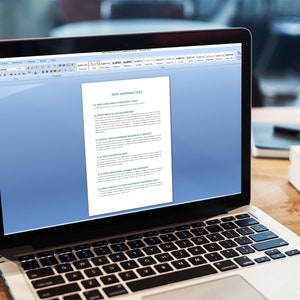 May include: A laptop computer with a white background and a document open on the screen. The document is titled "Self Maintenance Page 1" and contains a list of questions. The laptop is on a wooden table with a green plant and a small succulent plant in a wooden box.