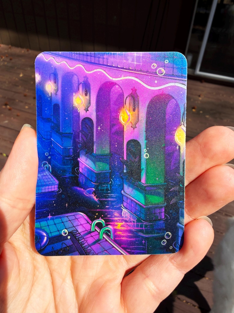 May include: A rectangular sticker featuring a vibrant digital illustration of an indoor swimming pool at night. The scene is illuminated by glowing yellow lanterns hanging from arched pillars, casting purple, blue, and green light reflections.