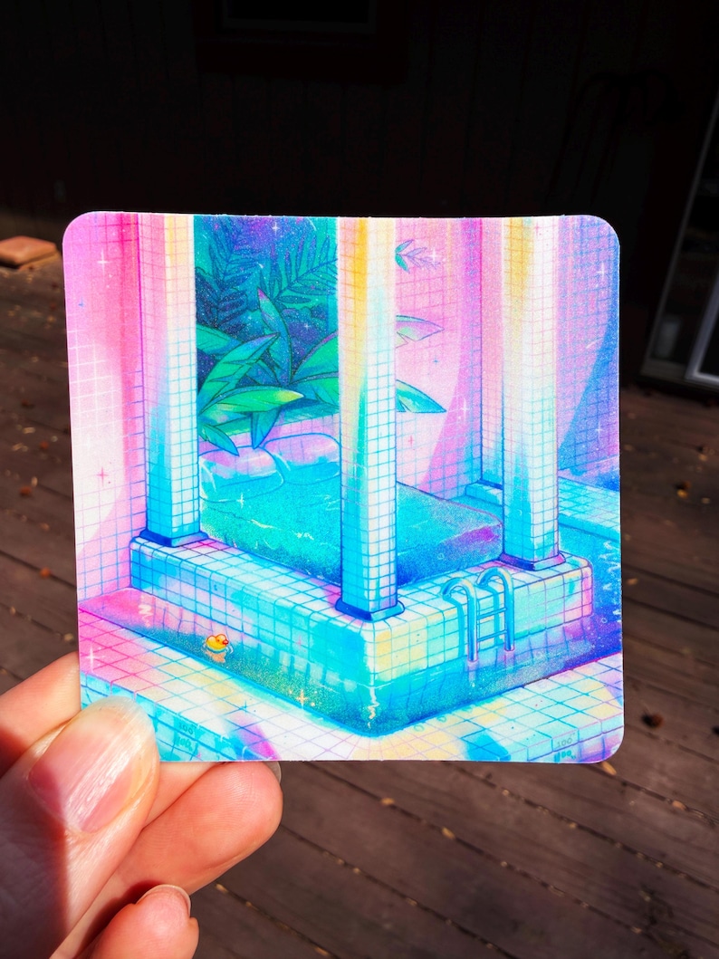 May include: A square sticker featuring a vibrant illustration of a bed placed inside a tiled swimming pool. The scene uses a gradient of pink, blue, and purple hues, with tall columns, lush green tropical plants, and a small yellow duck toy.