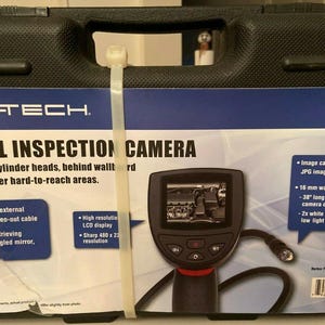 May include: A Centech digital inspection camera kit in a black case. The kit includes a camera with a 38-inch flexible cable, a high-resolution LCD display, and attachments for hard-to-reach areas. The camera captures JPG images.