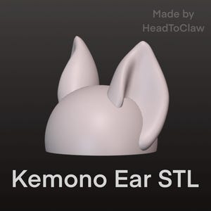 May include: A 3D-rendered, light-colored Kemono Ear STL model. The model features a rounded base with two upright ears and a smaller, pointed ear. Text on the image reads "Made by HeadToClaw" and "Kemono Ear STL".