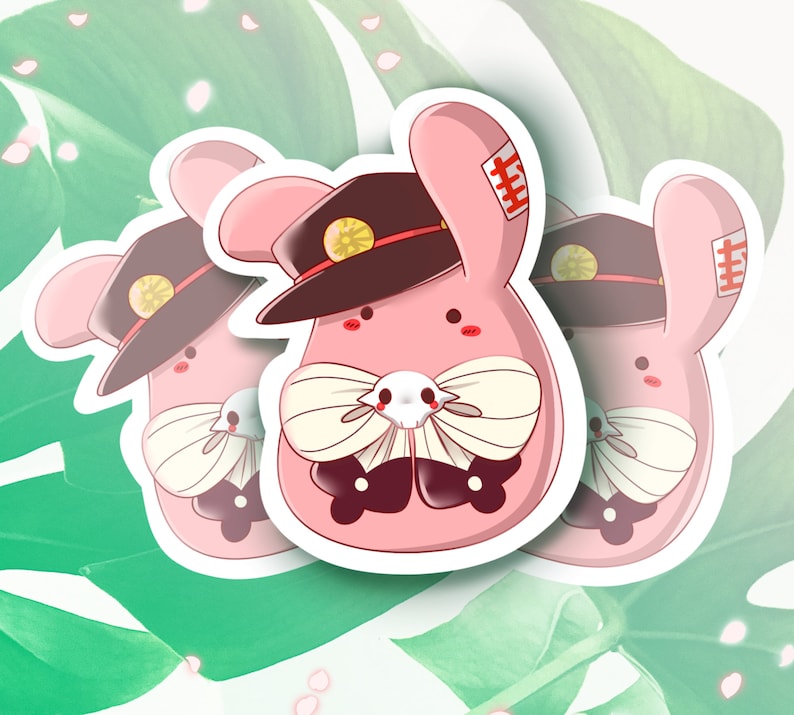 May include: Three pink bunny stickers with black hats, white bows, and black eyes. Each bunny has a red patch on its ear with Japanese characters.