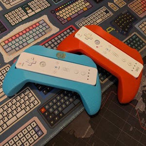 May include: A set of three ceramic mugs with a speckled, matte finish. The mugs are in shades of cream, light gray, and dark gray. Each mug has a simple, minimalist design, perfect for coffee or tea.