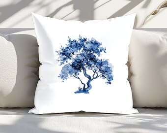 May include: A white throw pillow with a blue watercolor painting of a tree. The tree has a thick trunk and branches with leaves.