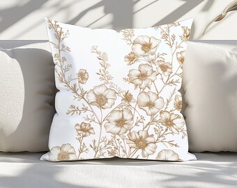 May include: White throw pillow with a brown floral pattern. The pillow features a delicate design of stylized flowers and leaves.