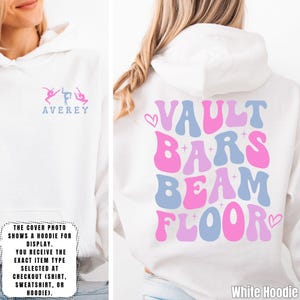 May include: White hoodie with the text "VAULT BARS BEAM FLOOR" in pink and blue. The front of the hoodie has the word "AVEREY" and a gymnast graphic. The cover photo shows a hoodie for display.