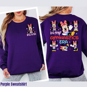 A purple sweatshirt with Minnie Mouse and text printed on it.