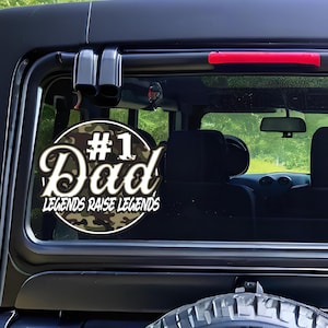 May include: A black and green camouflage sticker with the text "#1 Dad Legends Raise Legends".