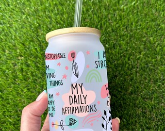 May include: White frosted glass tumbler with a bamboo lid and a clear plastic straw. The tumbler has a colorful design with the text "My Daily Affirmations" and "I Respect Myself".