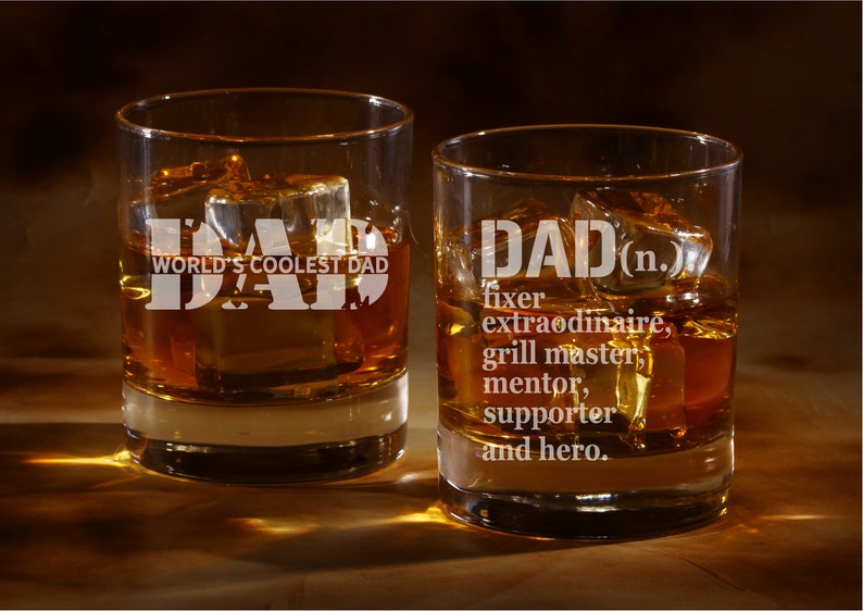 May include: Two clear glass tumblers with the word "DAD" etched on them. One tumbler says "World's Coolest Dad" and the other says "DAD (n.) fixer extraordinaire, grill master, mentor, supporter and hero."