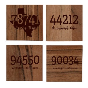 May include: Four wooden coasters with dark brown text. Each coaster features a different zip code and city: 78741 Austin, Texas; 44212 Brunswick, Ohio; 94550 Livermore, California; and 90034 Los Angeles, California.