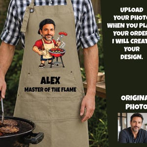 May include: A beige apron featuring a cartoon illustration of a person grilling with a sausage and a beer, with the text "ALEX MASTER OF THE FLAME" printed below. The right side includes text instructions and a small original photo of a man.