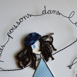 enfant de la lune personnage en fil de fer