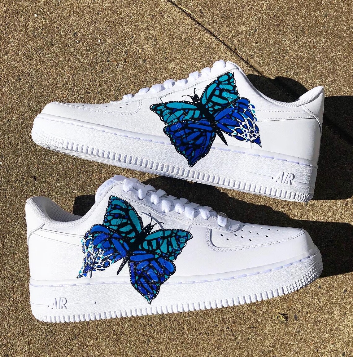 white shoes with blue butterflies