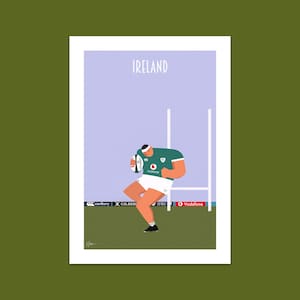 May include: A cartoon illustration of a rugby player in a green and white jersey, holding a rugby ball and scoring a try. The player is wearing white shorts and black socks. The background is a purple sky with a green field and white goal posts. The text "IRELAND" is at the top of the image.