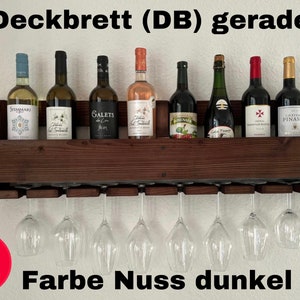 May include: A dark brown wooden wine rack with eight wine glasses hanging below and seven wine bottles on top. The text "Deckbrett (DB) gerade" and "Farbe Nuss dunkel (C)" are visible.