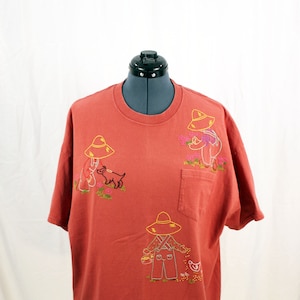 Rust colored XL unisex short-sleeved crew neck t-shirt embroidered with cute farmers using vintage embroidery patterns