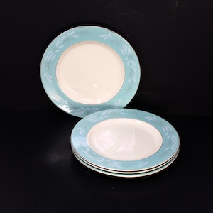 4 vintage Homer Laughlin Cavalier Eggshell dinner plates; turquoise border with white leaf and pink flower bud detail, silver rim