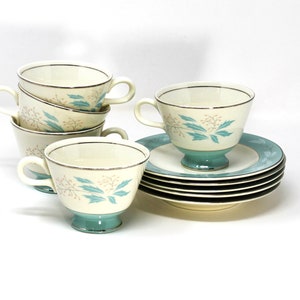 5 Homer Laughlin Cavalier teacup/saucer sets; cups w/ turquoise trim/leaves, pink buds; saucers w/ turquoise border, white leaves, pink buds