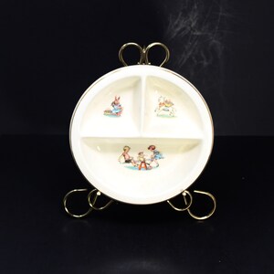 Vintage Salem China Co. divided children&#39;s bowl; 23 kt gold rim; sections feature children on see-saw, rabbit, and lamb