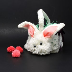 White crocheted Easter bunny basket craft glue the nose on the bunny includes glue pom poms and Easter grass