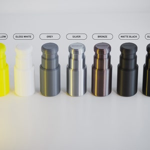 May include: Eight different coloured bottle stoppers, including gloss yellow, gloss white, grey, silver, bronze, matte black, and gloss black.