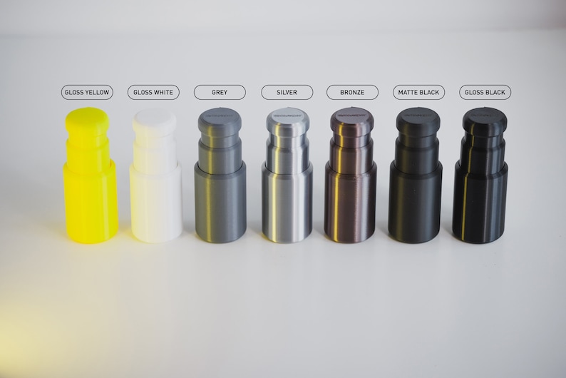 May include: Eight different coloured bottle stoppers, including gloss yellow, gloss white, grey, silver, bronze, matte black, and gloss black.