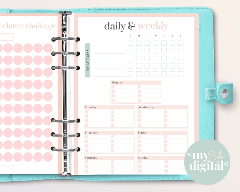May include: A pink and white planner with a daily and weekly schedule. The planner has a section for daily tasks and a section for decluttering challenges. The planner is designed for use with a disc-bound system.