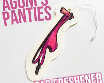 May include: A pink car air freshener shaped like a pair of panties with the text "Agoni's Panties" and "Car Freshener" printed on the white background.