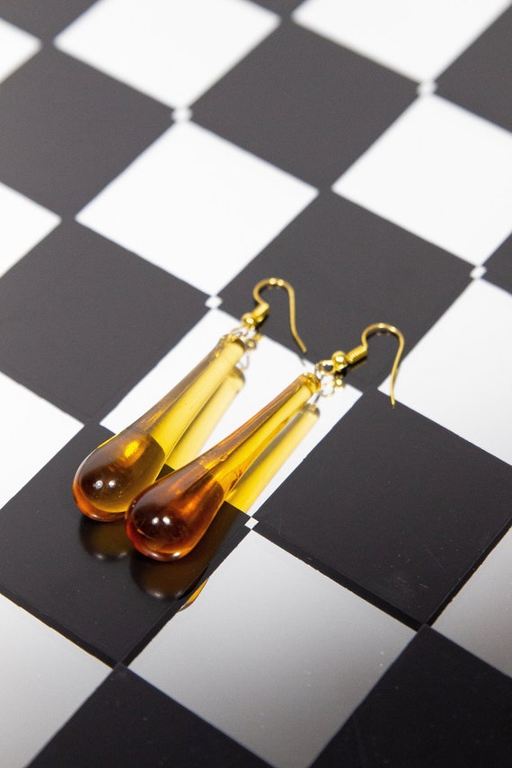 Amber glass drop earrings.