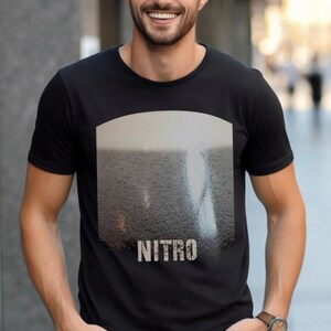 May include: Black t-shirt with a graphic of a glass of beer with the word "NITRO" printed below it.