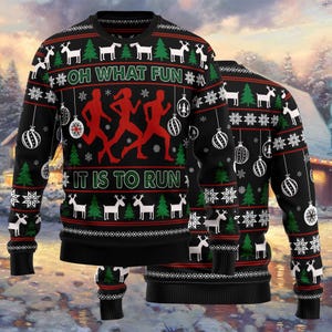 May include: Black Christmas sweater with a festive design. The sweater features white reindeer, snowflakes, and Christmas tree patterns. The text "OH WHAT FUN IT IS TO RUN" is displayed in green and white, with red running figures in the center.