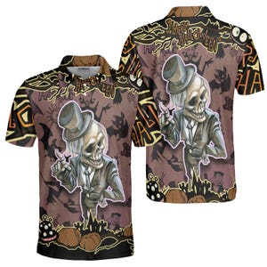 May include: A short-sleeved polo shirt with a Halloween theme. The shirt features a cartoon skeleton wearing a suit and top hat, with the words "Happy Halloween" in a decorative font. The background includes bats, pumpkins, and other spooky elements.