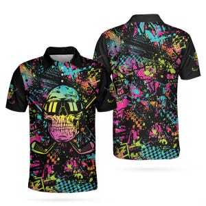 May include: Black polo shirt featuring a colorful skull wearing sunglasses and crossed golf clubs. The design includes splashes of pink, yellow, blue, and green. The back of the shirt has a similar design with a checkered pattern.