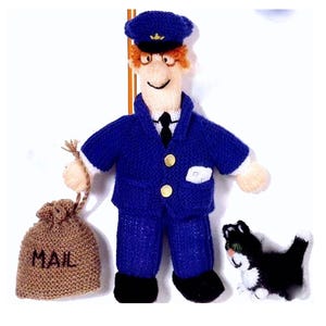 May include: A knitted doll of a mail carrier in a blue uniform, cap, and black shoes, holding a tan mail bag with "MAIL" printed on it. A black and white cat is at his feet. The doll has red hair and glasses.