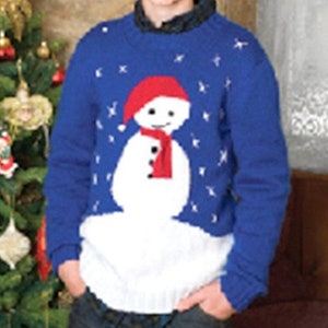 May include: A blue knitted sweater with a white snowman design. The snowman has a red hat and a red scarf. The sweater has a snowflake pattern.