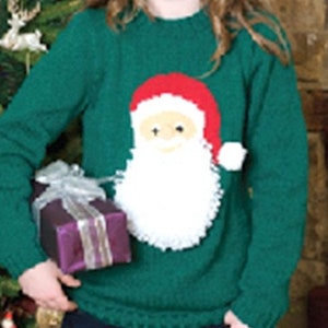 May include: A green knitted sweater with a white Santa Claus design. The sweater has a crew neck and long sleeves.