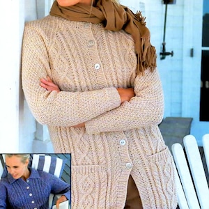 May include: A beige cable-knit cardigan with a button-up front and two front pockets. The long-sleeved sweater has a textured design and is paired with a brown scarf. The cardigan is a classic style, perfect for layering.