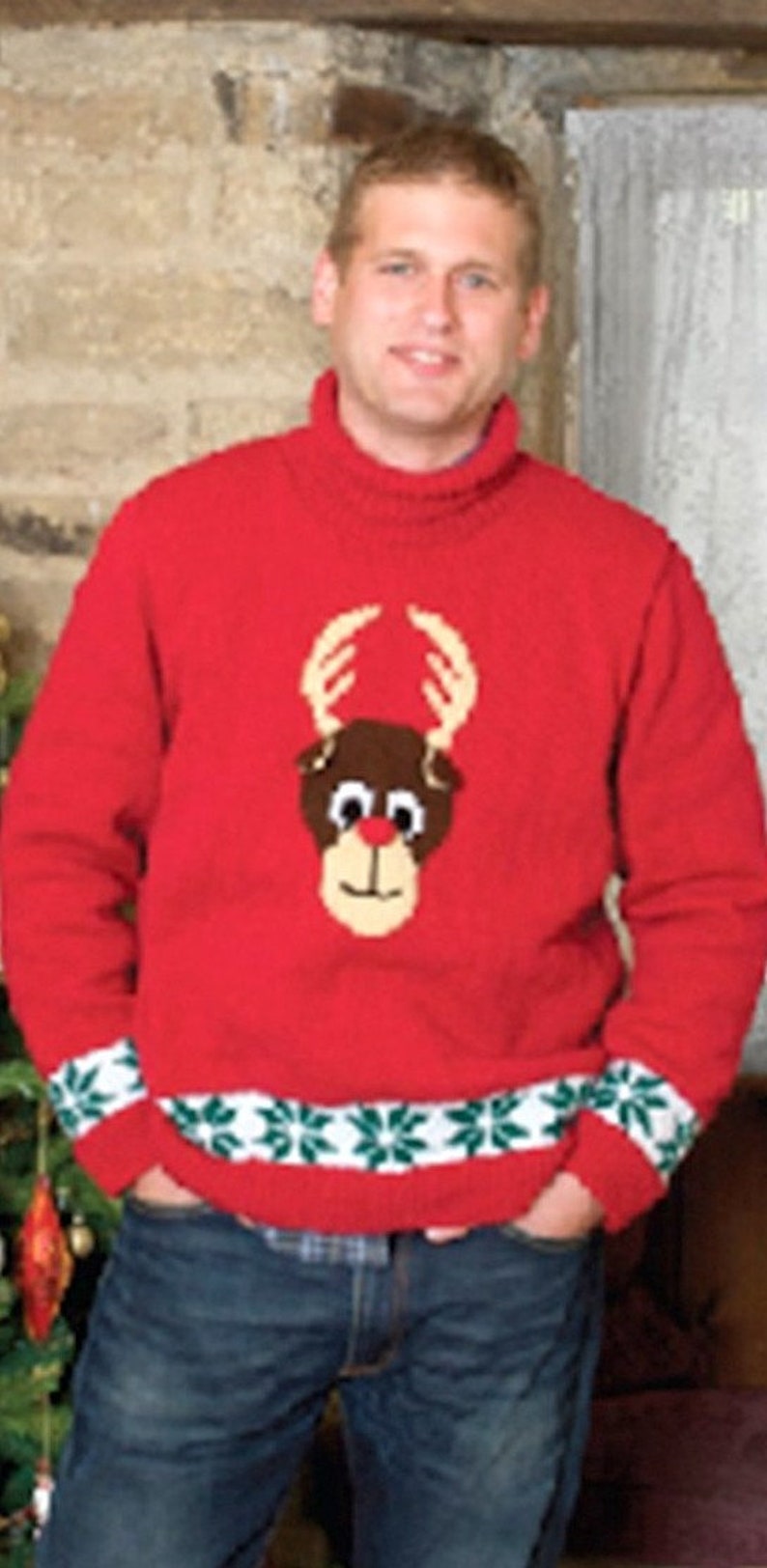 May include: A red knitted sweater with a green and white snowflake pattern around the bottom. The sweater features a brown reindeer with a red nose and white eyes.
