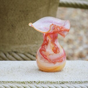 Orange-pink blown glass vase