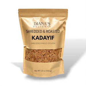 May include: A brown paper bag of shredded and roasted Kadayif, a shredded phillo dough. The bag has a clear window showing the product. The bag reads "Diana's Delights" and "Net WT 20 oz (566 g)".
