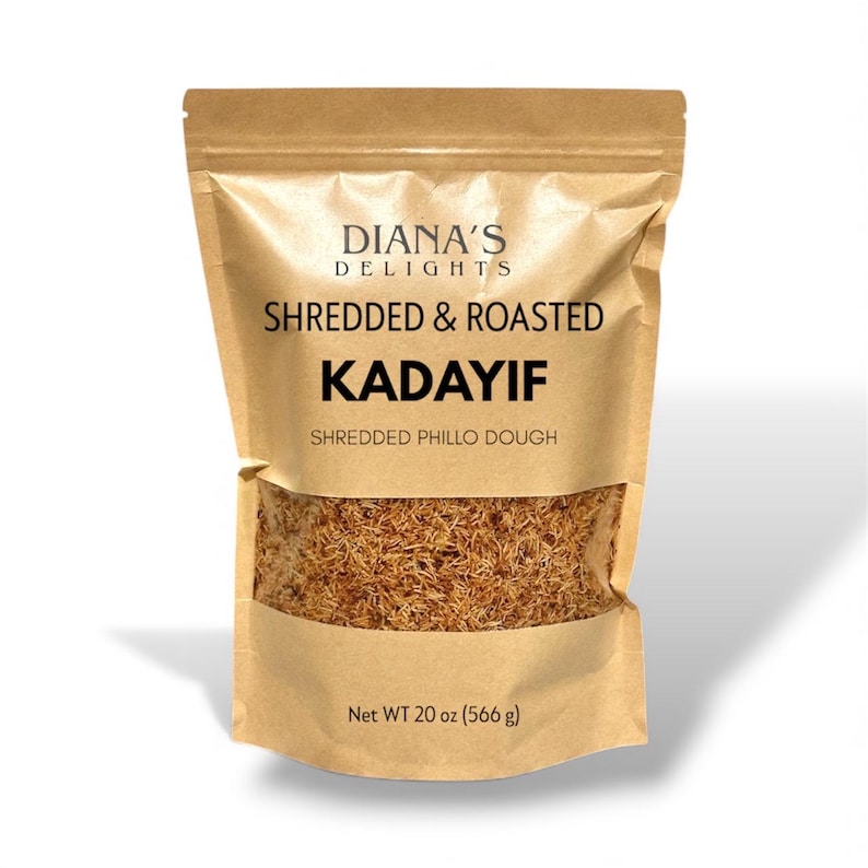 May include: A brown paper bag of shredded and roasted Kadayif, a shredded phillo dough. The bag has a clear window showing the product. The bag reads "Diana's Delights" and "Net WT 20 oz (566 g)".