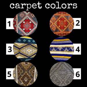 May include: Six different carpet samples with geometric patterns in various colors, including red, blue, yellow, and brown. The samples are numbered 1 through 6.