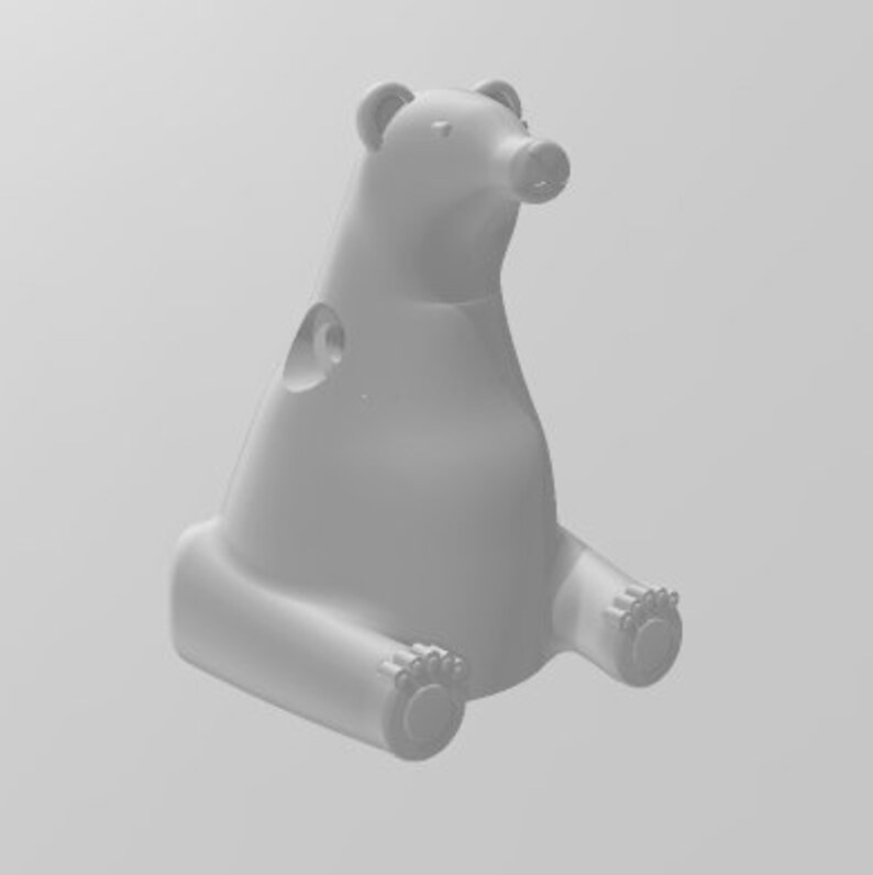 May include: White ceramic bear figurine sitting with its legs crossed. The bear has a simple design with no details.